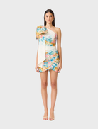Multi floral one-shoulder mini dress featuring a vibrant design and fitted silhouette.