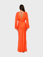 Long sleeve orange maxi dress with a flowing silhouette, perfect for casual or formal occasions.
