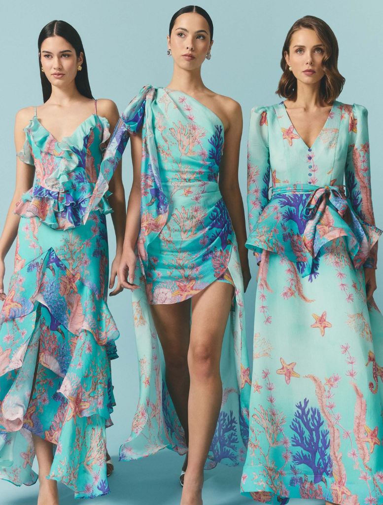 Coral asymmetrical gown in blue and multi colors, featuring a flowing design and elegant silhouette.