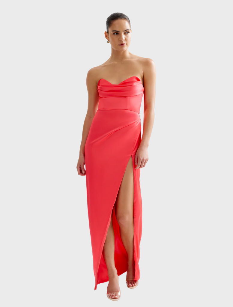 Elegant Lucy dress in cranberry, featuring a tailored silhouette and a graceful skirt, ideal for various events.