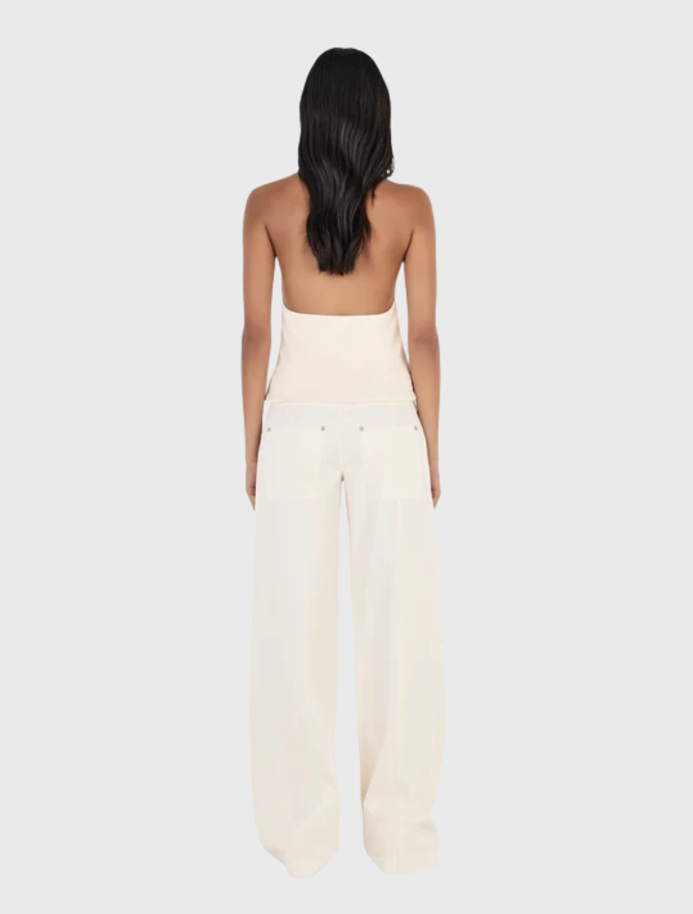 Relaxed straight leg cargo pant in cream, featuring a low-rise fit, zip fly, belt loops, and functional pockets for convenience.