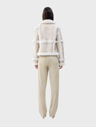 Elegant cream Talamasca jacket showcased, highlighting its versatile style and soft fabric ideal for layering.