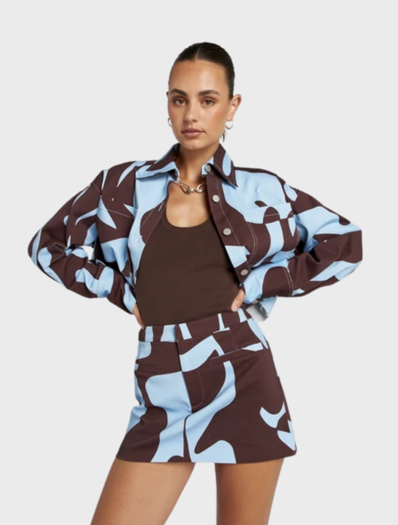 Relaxed Cropped Shacket showcasing hand-drawn Mirage artwork in earthy tones, ideal for seasonal layering and casual outings.