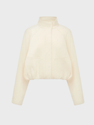 Elegant ivory cropped bomber jacket, showcasing a modern silhouette and ribbed detailing on the sleeves.