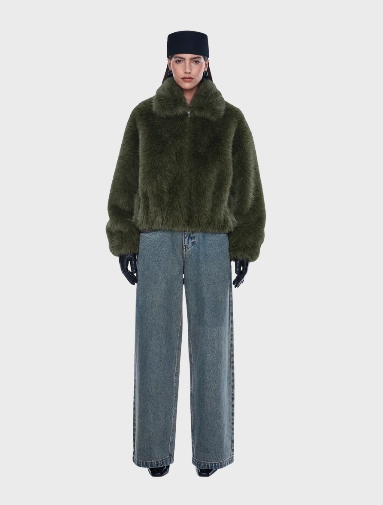 Olive faux fur bomber jacket with oversized fit, standard collar, front zipper, side pockets, and elasticated hem and cuffs.