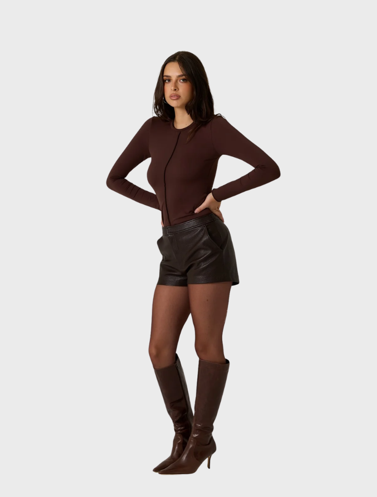 Elegant dark truffle shorts crafted from vegan leather, blending style with eco-friendly materials.