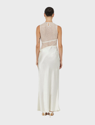 Elegant floor-length dress in twilight hues, featuring a flowing silhouette perfect for formal occasions.