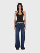 Black halterneck top with a keyhole front, low scooped back, and beaded neck tie, designed for a close-to-body fit.
