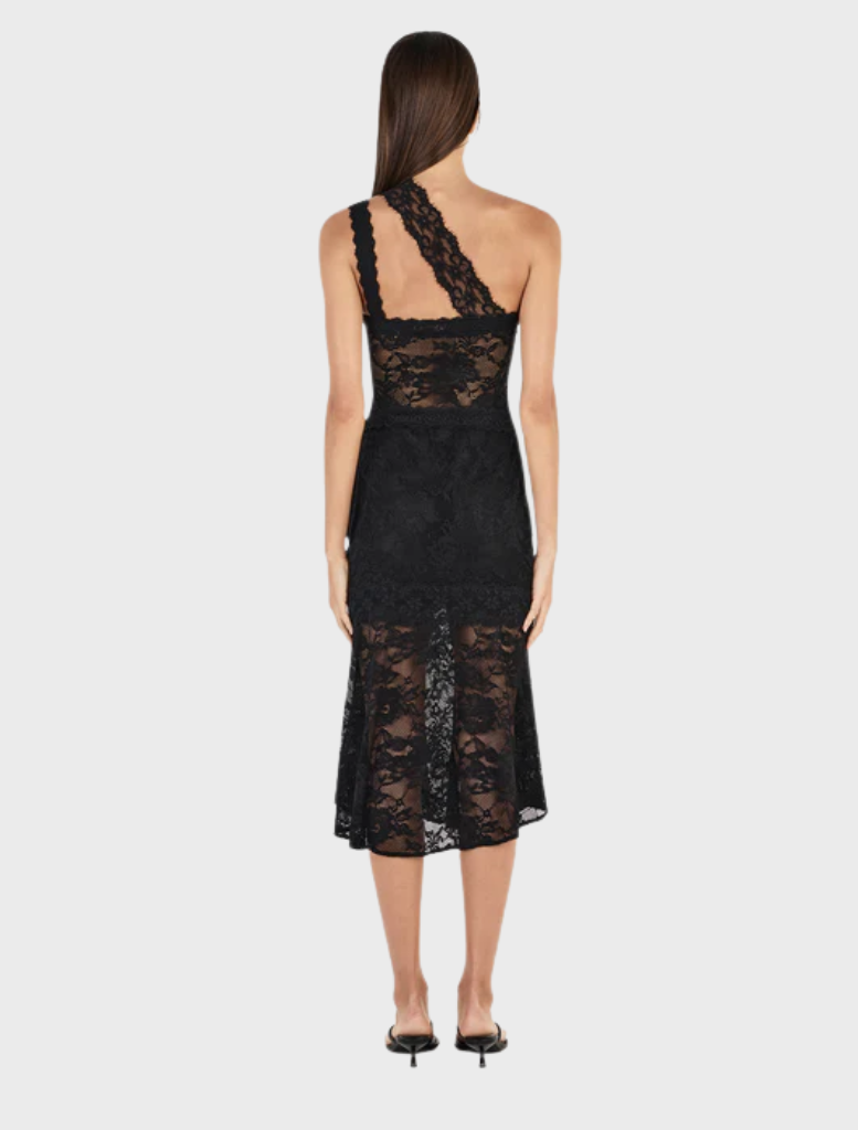 Black Della dress with a sleek design, showcasing a fitted bodice and a graceful, flowing skirt.