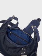 Dark blue denim shoulder bag featuring a modern design, perfect for everyday errands and casual outings.
