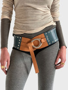 Nuvola belt in vibrant colours, designed with a buckle and two adjustable straps.