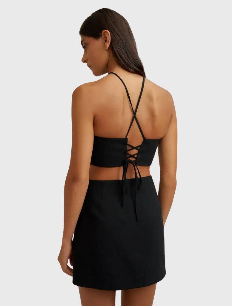 Black and pink Diamond Halter Mini Dress with a fitted silhouette, lace-up back, and subtle cut-outs for a stylish look.