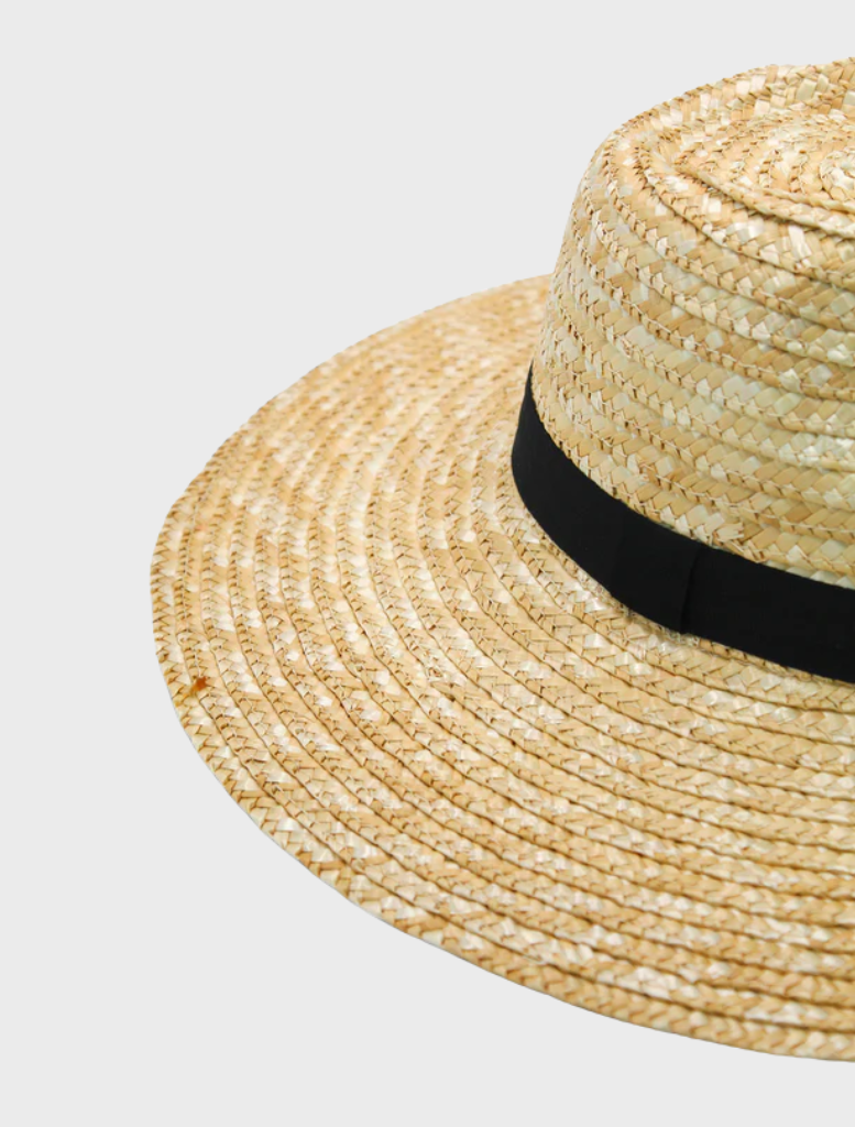 Elegant black Dion Fedora hat showcasing a wide brim and a decorative band, perfect for formal occasions.