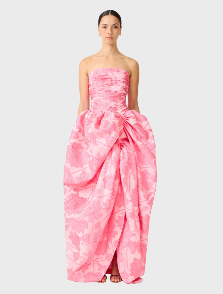 Pink strapless ball gown with a fitted bodice and flowing skirt, perfect for formal occasions.