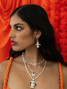 Stylish silver Diya necklace with ornate detailing, ideal for enhancing any outfit.