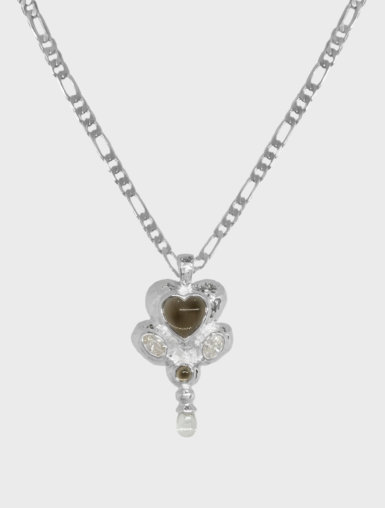Silver Diya necklace featuring intricate design and elegant craftsmanship.