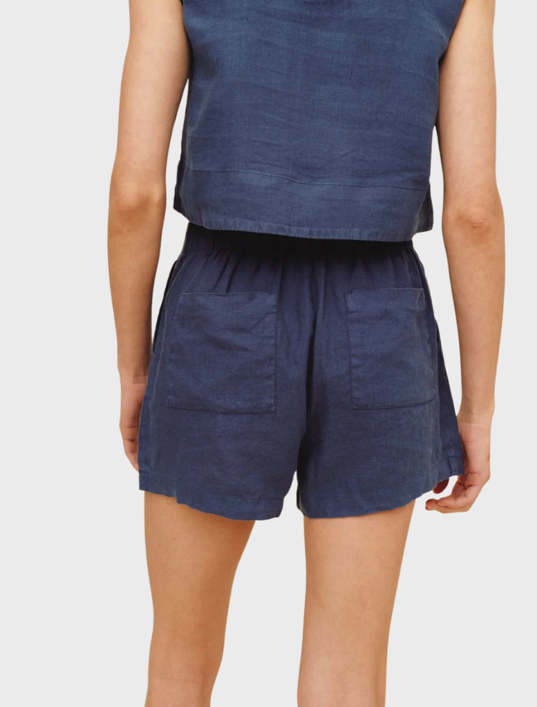 Double pleat shorts in a deep midnight surf hue, perfect for relaxed summer outings and casual occasions.