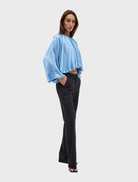 Lapis Dreamt Blouse offers a relaxed fit with gathered neckline, wide sleeves, and a flowing silhouette for an elegant look.