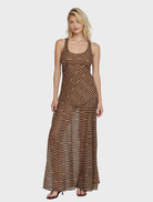 A woman in a Driftline Maxi Sun Dress, standing outdoors, emphasizing the dress's lightweight fabric and elegant silhouette.