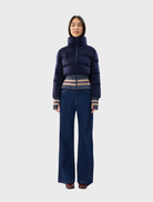 Navy Dublin jacket displayed on a hanger, featuring a sleek design and modern cut suitable for various occasions.