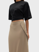 Stylish ebony skirt in dune shade, featuring a modern silhouette perfect for both casual and formal wear.