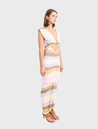 Peach-colored Elara Dress with a graceful design, suitable for both casual outings and special events.