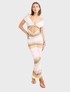 Peach-colored Elara Dress with a graceful design, ideal for both casual and formal settings.