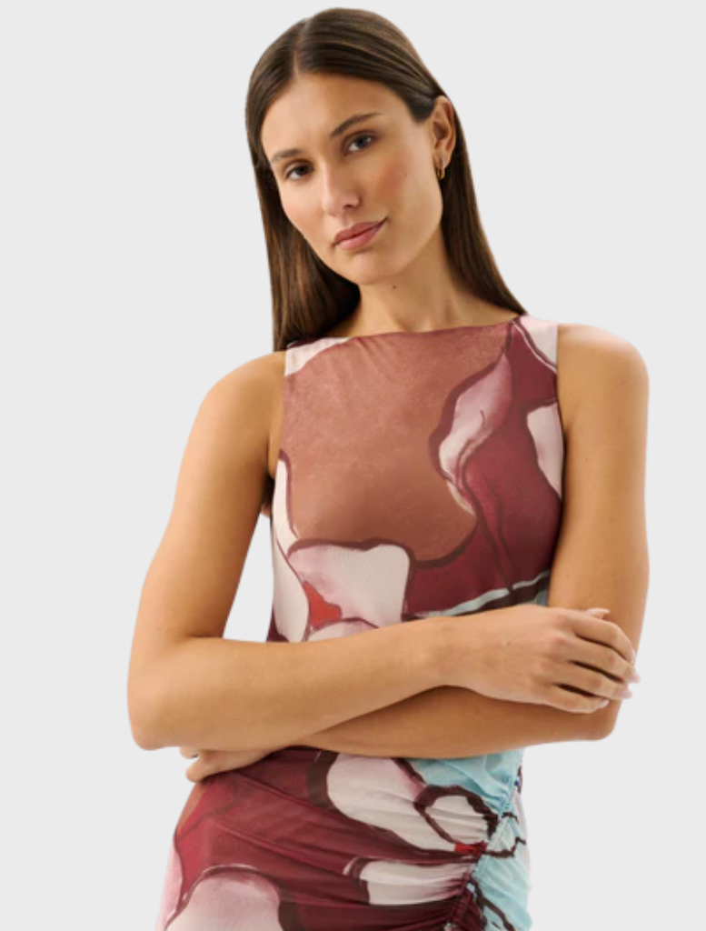 The Avalon Dress, adorned with the Marisol Bloom pattern, offers a chic and feminine style suitable for various occasions.