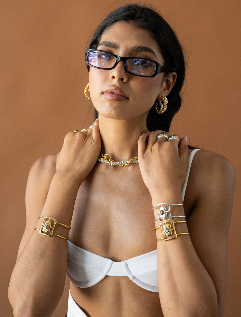 Elegant gold Gabrielle earrings with a unique design, perfect for adding a touch of glamour to any outfit.
