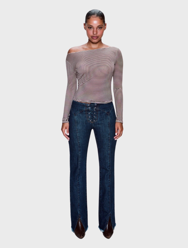 Dark wash Element lace-up jeans displayed on a wooden surface, showcasing their stylish design and unique lace-up feature.