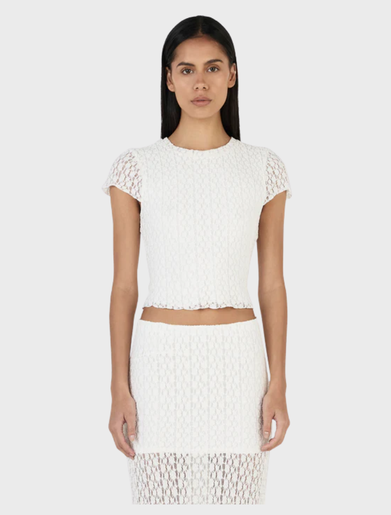 Ivory baby tee featuring a playful Elsa design, perfect for young fans of Disney's Frozen.