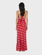 Vibrant red maxi dress with playful white polka dots, offering a chic and comfortable option for various summer occasions.