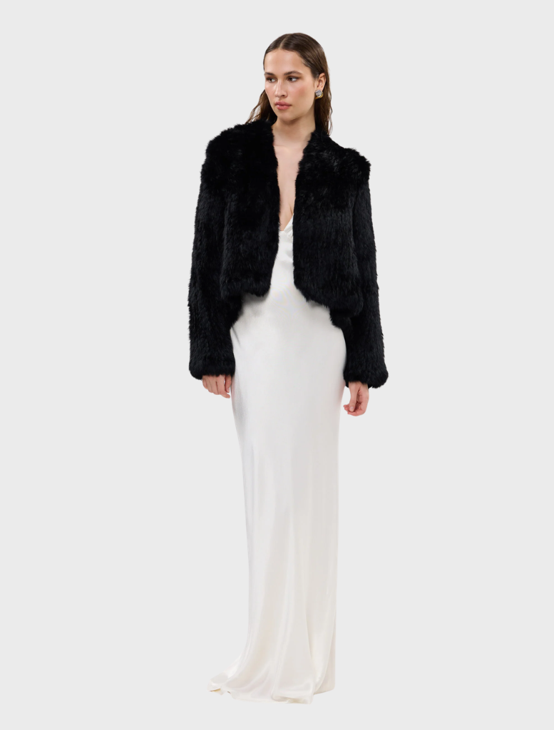Black Emma Jacket displayed on a hanger, featuring a sleek design and modern silhouette suitable for various occasions.