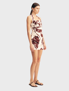 Emmett Halter Draped Mini Dress with a redwood wallpaper design, highlighting a chic halter neckline and flowing draped fabric.