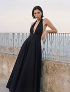 Elegant black Evalina Taffeta gown with a flowing silhouette and intricate detailing, perfect for formal occasions.