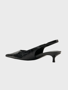 Chic black leather sling heel shoe with a pointed toe, made from Evette's distinctive black oily crinkle leather.