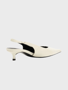 Chic white shoe with a pointed toe and heel, designed in Bone Oily Crinkle Leather for a modern aesthetic.