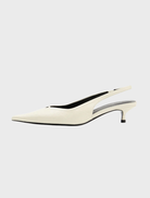 White pointed toe and heel shoe made of Bone Oily Crinkle Leather, showcasing a sleek and elegant design.