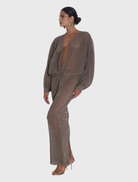 Elegant floor-length gown with a deep neckline, long sleeves, and delicate smoke sequin fabric, designed for a striking silhouette.