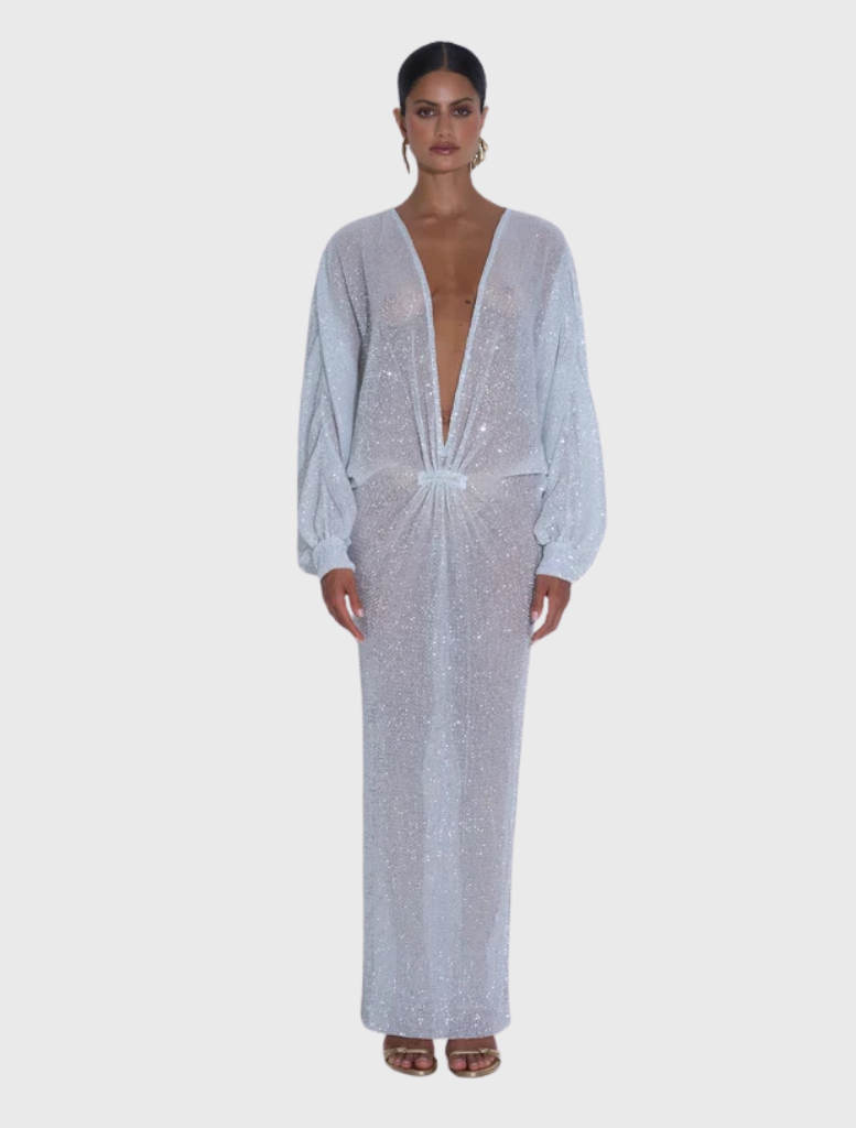 Sparkle gown with a plunging neckline and relaxed long sleeves, showcasing a fluid silhouette and luxurious texture.