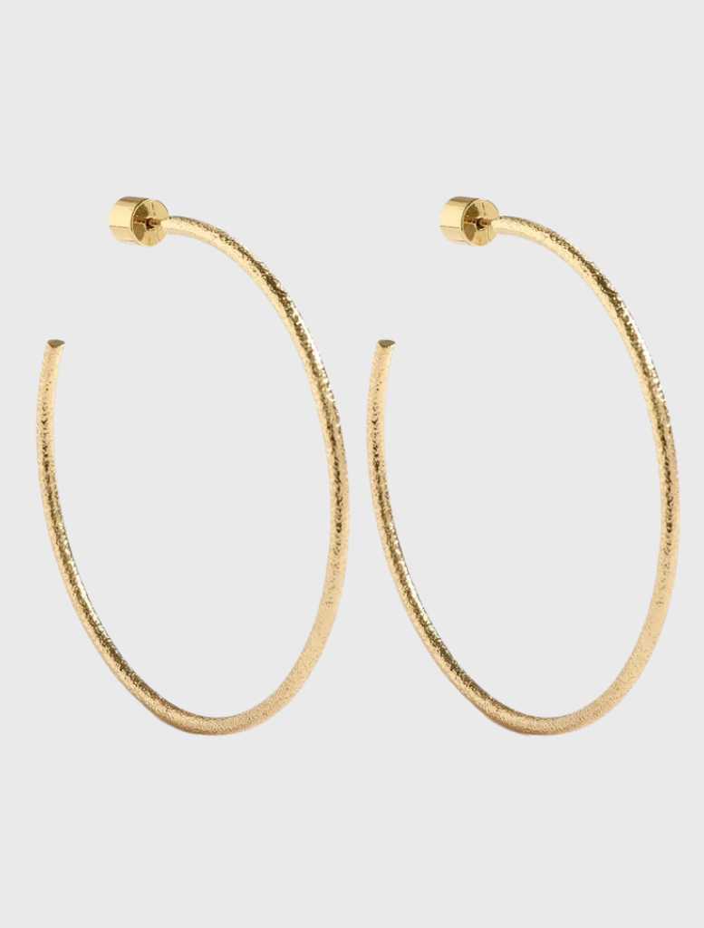 Gold hoop earrings with a hammered finish, designed by Emma Pills, featuring a stud back closure for sensitive ears.