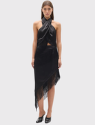 Black Fay Skirt featuring an asymmetric silhouette, layered fringe trim, and a fitted waistband with diagonal detailing.
