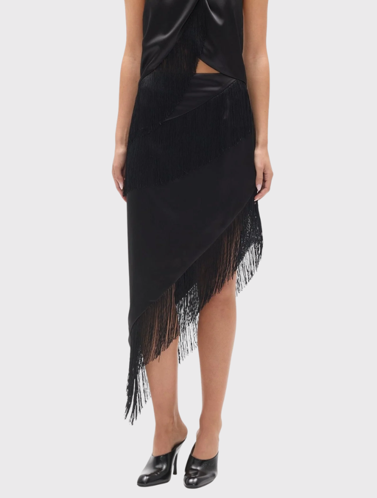 Black Fay Skirt with a fitted waist, diagonal panel detailing, and an angled hem, designed for dynamic movement.