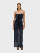 Long, flowing maxi skirt in a smoke color, featuring a stylish flicker bias design for a modern look.