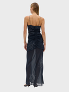 Flowing maxi skirt in a soft smoke shade, featuring a unique flicker bias design for a trendy look.