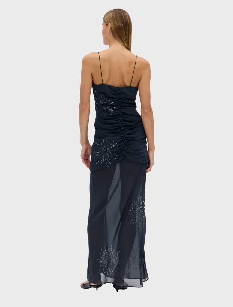 Flowing maxi skirt in a soft smoke shade, featuring a unique flicker bias design for a trendy look.