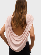 Woman's back view in a pink Flora Bodysuit - Ballet, highlighting the stylish and contemporary look.