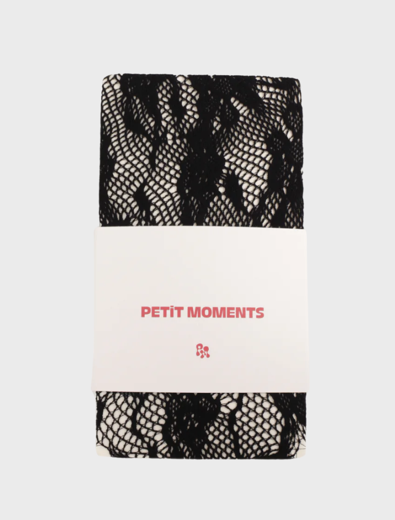 Black Flora Tights displayed on a white background, showcasing their sleek design and fabric texture.