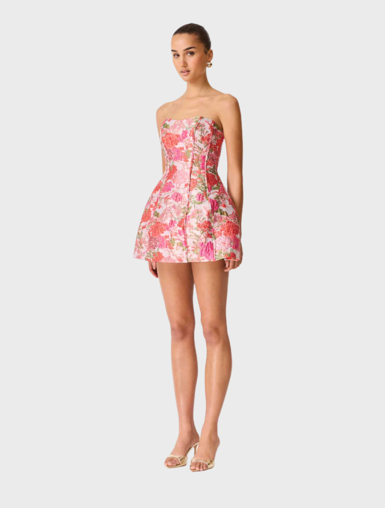 Strapless mini dress in pink with a vibrant floral pattern, designed for a stylish summer look.