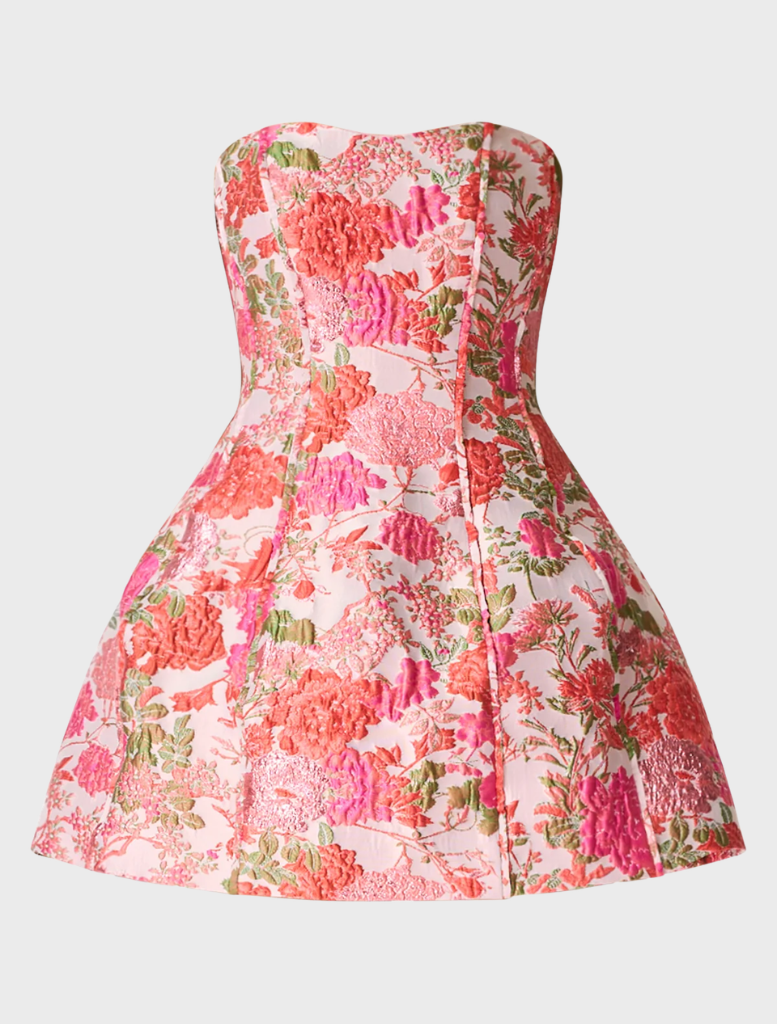 Strapless mini dress in pink with a vibrant floral pattern, featuring a fitted silhouette and playful hemline.